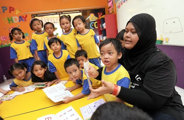 Early Childhood Education graduate teaching children.