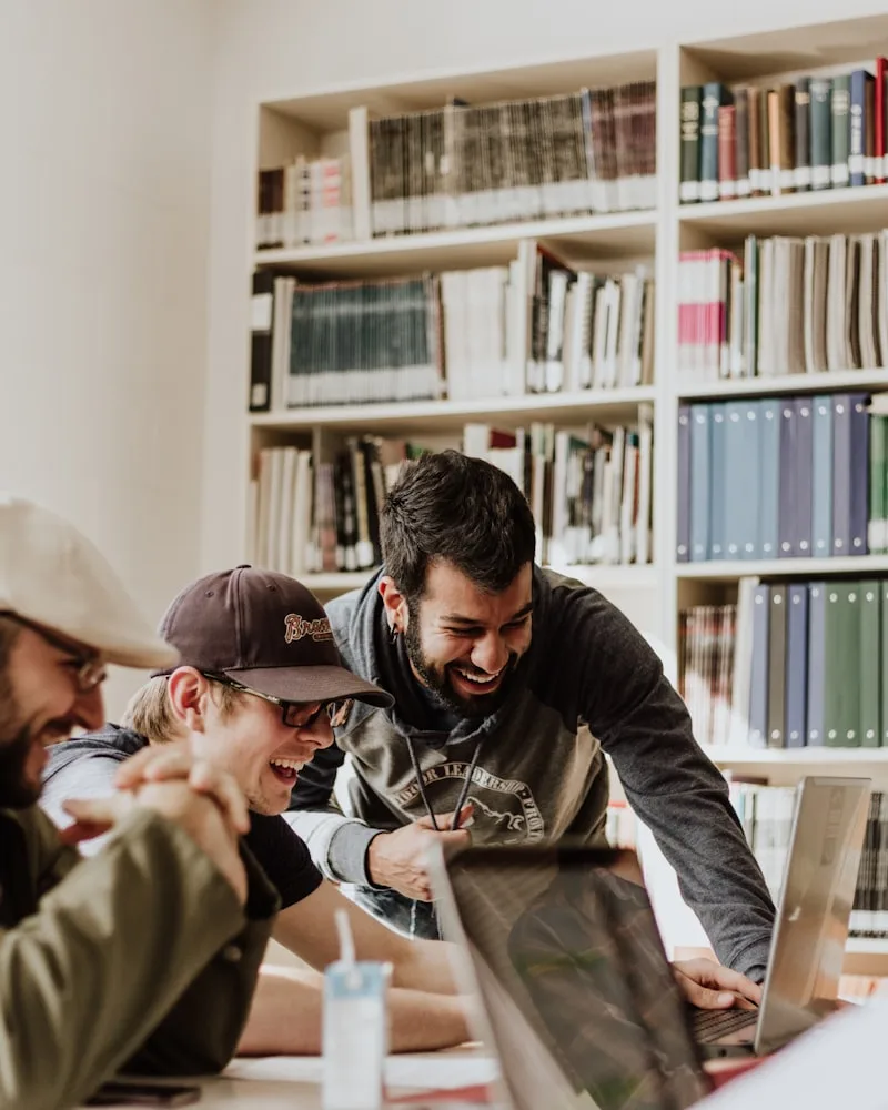Diverse group of happy university students collaborating and studying together